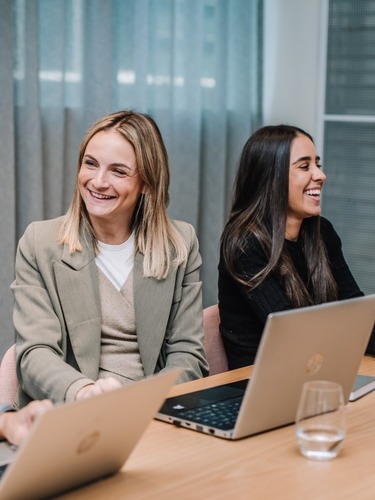 Sharp & Carter Specialist Recruitment About Us, Female Co-Workers Talking