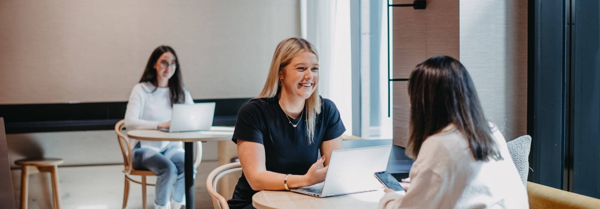 Sharp & Carter Specialist Recruitment, Work For Us, Female Consultants Talking and Smiling